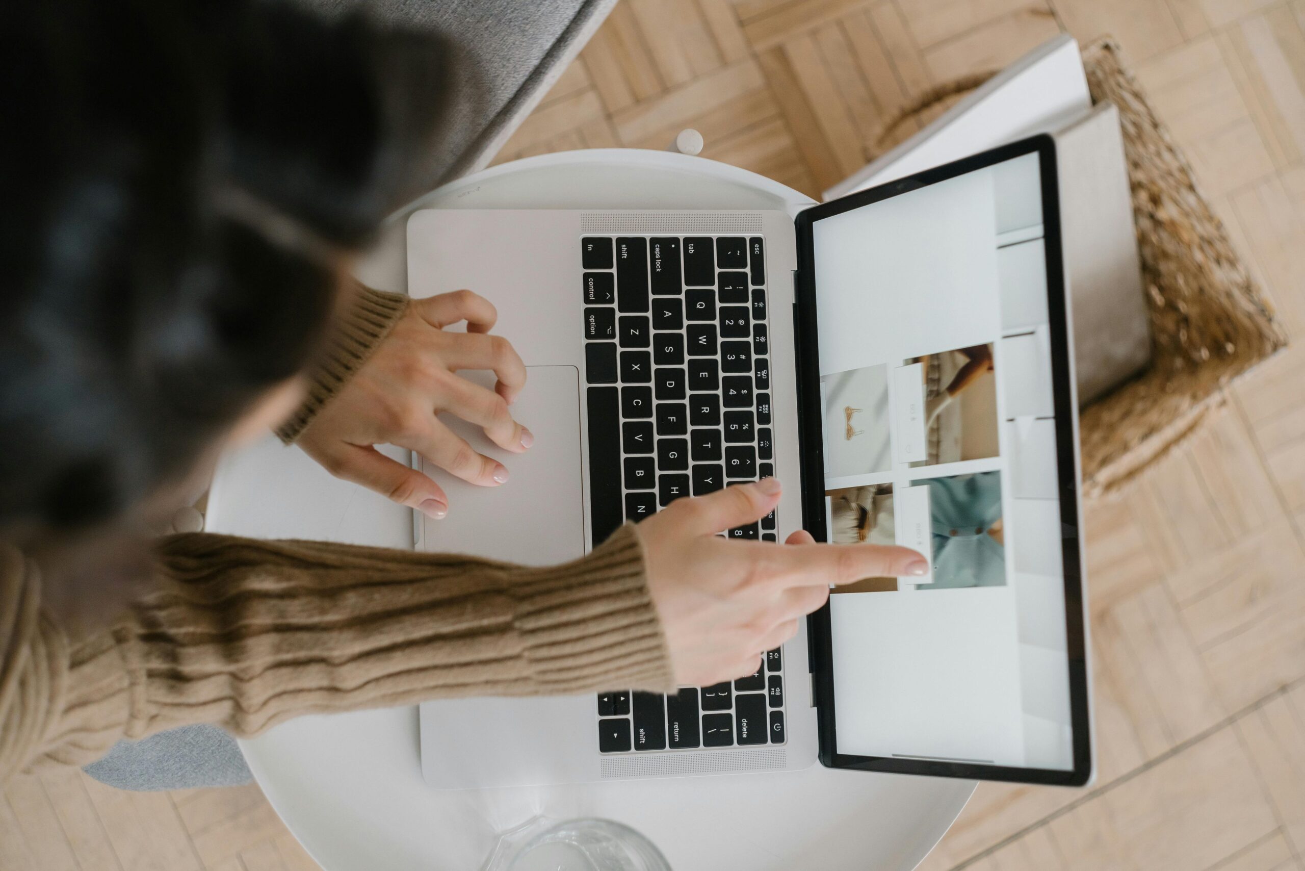 Facebook ad graphics, image of a woman pointing to an image on her laptop screen.