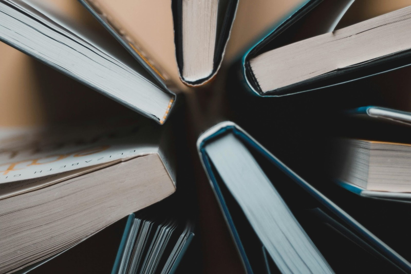 best self-publishing platform, top view of paperback and hardcover books grouped together.